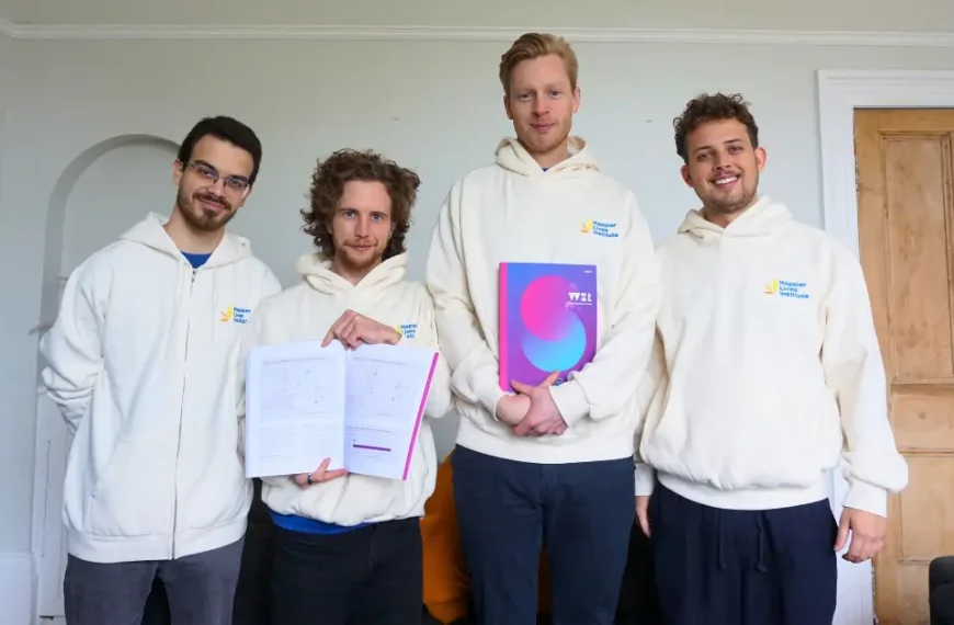 Researchers from the Happier Lives Institute with a physical copy of the 2025 World Happiness Report